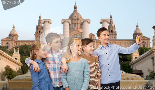 Image of happy children talking selfie by smartphone