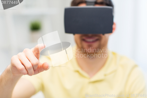 Image of young man in virtual reality headset or 3d glasses