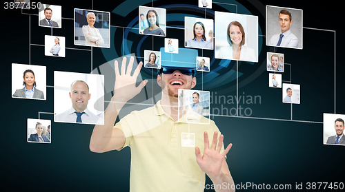 Image of happy man in virtual reality headset or 3d glasses