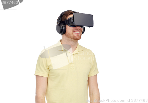 Image of happy man in virtual reality headset or 3d glasses