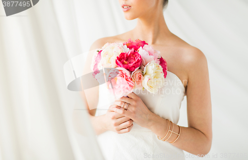Image of close up of woman or bride with flower bouquet