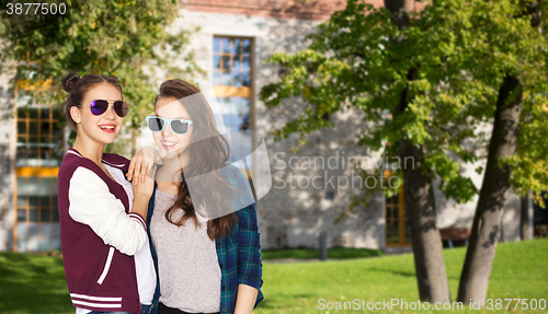 Image of happy smiling pretty teenage girls in sunglasses