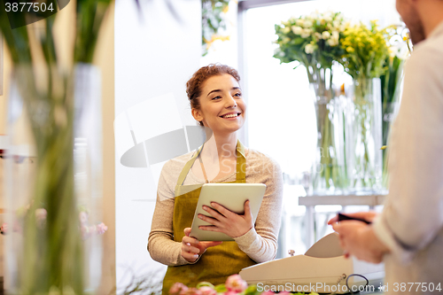 Image of florist woman and man making order at flower shop