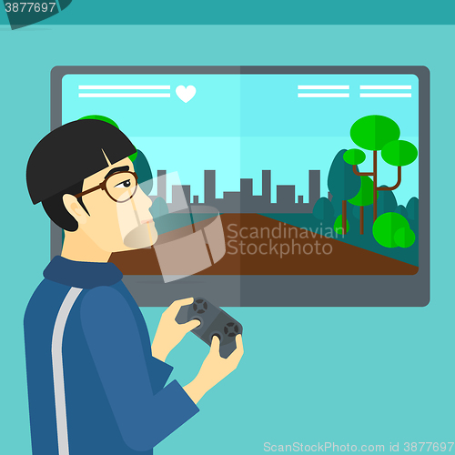 Image of Man playing video game.