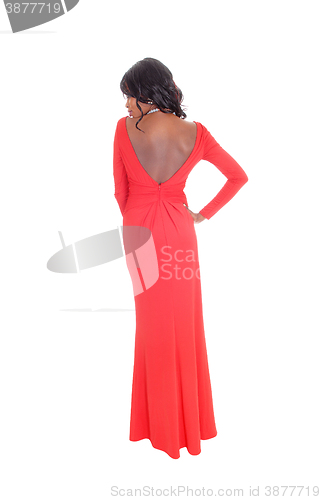 Image of African American woman red long dress from back.