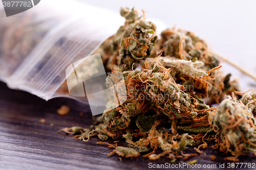 Image of Close up Dried Marijuana Leaves on the Table