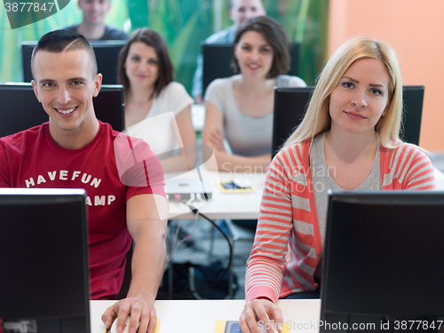 Image of technology students group in computer lab school  classroom
