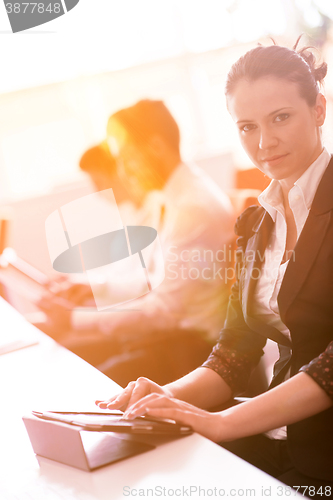 Image of business woman at  office people group on meeting  in background