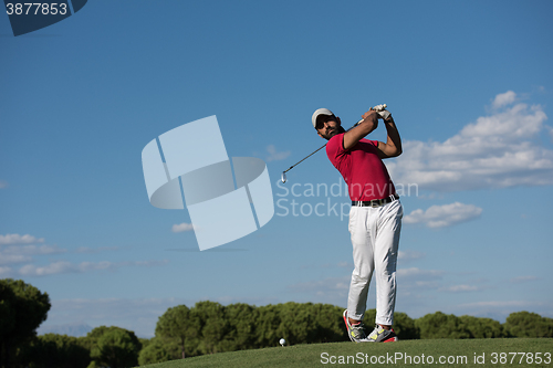 Image of golf player hitting long shot