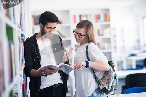 Image of students couple  in school  library