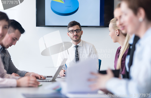 Image of young business people group on team meeting at modern office