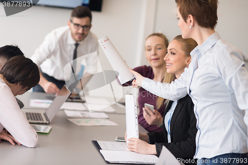 Image of young business people group on team meeting at modern office