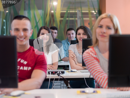 Image of technology students group in computer lab school  classroom