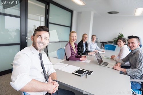 Image of young business people group on team meeting at modern office