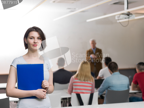 Image of portrait of happy female student in classroom