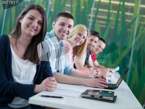 Image of group of students study together in classroom