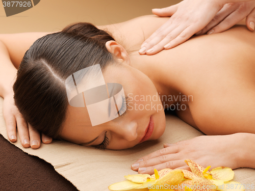 Image of beautiful woman in massage salon