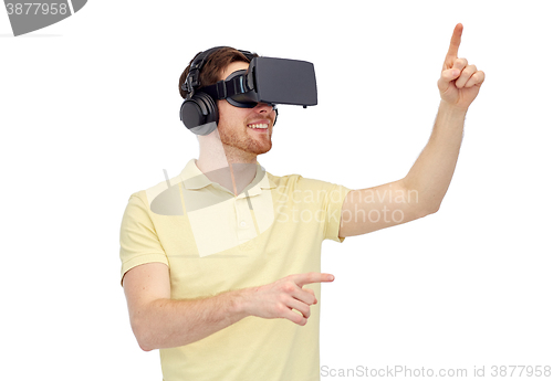 Image of happy man in virtual reality headset or 3d glasses