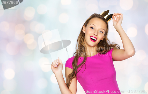 Image of happy young woman or teen girl in pink dress