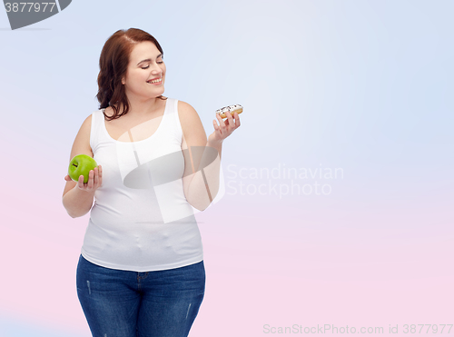 Image of happy plus size woman choosing apple or donut