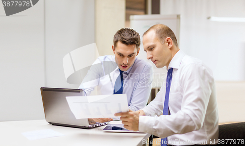 Image of two businessmen having discussion in office