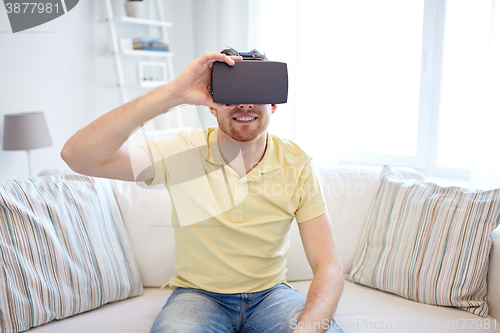 Image of young man in virtual reality headset or 3d glasses