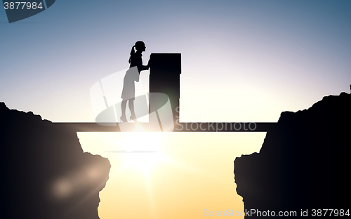 Image of silhouette of businesswoman moving boxes at office