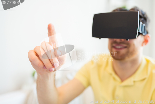 Image of young man in virtual reality headset or 3d glasses