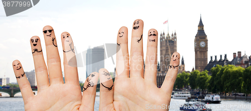 Image of close up of fingers with smiley faces wedding