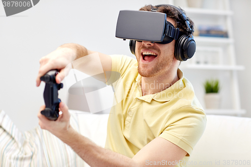 Image of man in virtual reality headset with controller