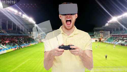 Image of man in virtual reality headset over football field