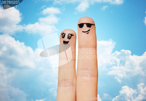 Image of close up of two fingers with smiley faces