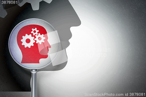 Image of Marketing concept:  Head With Gears with optical glass on digital background