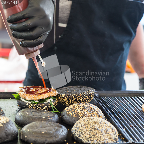 Image of Beef burgers ready to serve on food stall.