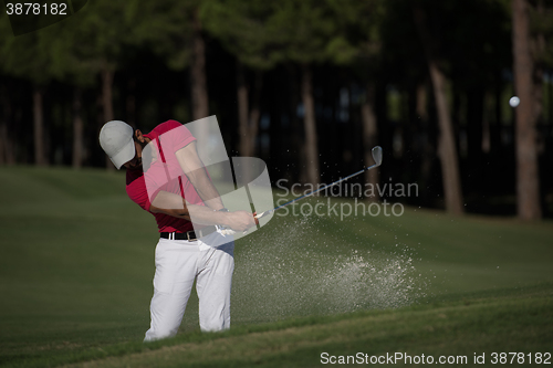 Image of golfer hitting a sand bunker shot