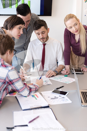 Image of young business people group on meeting at modern office