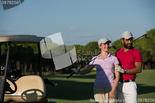 Image of couple in buggy on golf course