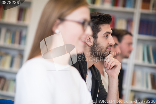 Image of group of students  raise hands up