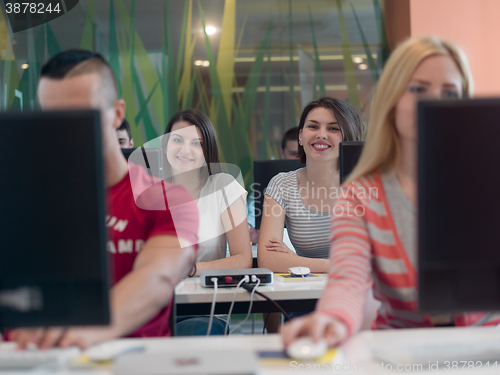 Image of technology students group in computer lab school  classroom