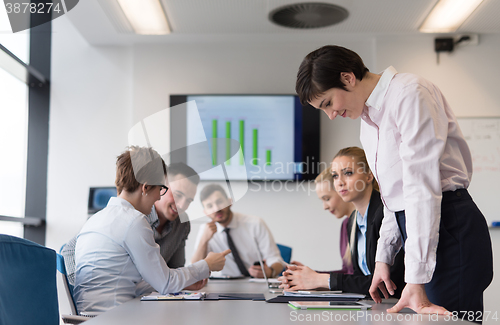 Image of young  woman using  tablet on business meeting