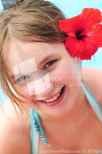 Image of Portrait of a girl with red flower