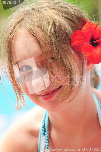 Image of Portrait of a girl with red flower