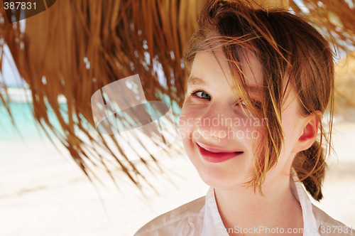 Image of Young girl on tropical beach