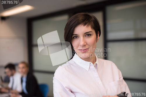 Image of hispanic businesswoman with tablet at meeting room