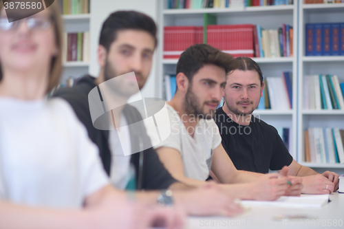 Image of group of students study together in classroom