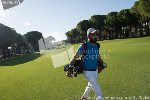 Image of golf player walking