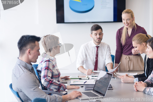 Image of young business people group on meeting at modern office