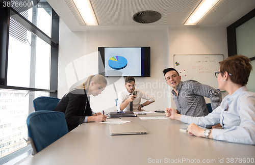 Image of young business people group on meeting at modern office