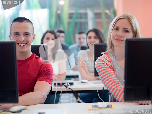 Image of technology students group in computer lab school  classroom