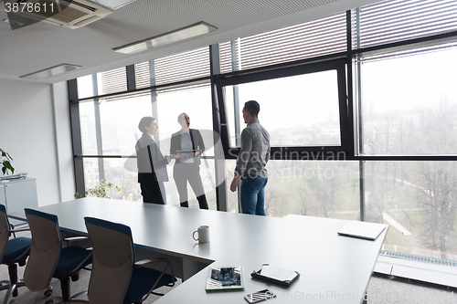 Image of young business people group on meeting at modern office